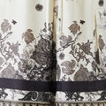 Black and white silk-effect pants with delicate Chinese-inspired print, fluid silhouette and minimalist monochrome design.