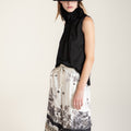 Black and white silk-effect pants with delicate Chinese-inspired print, fluid silhouette and minimalist monochrome design.