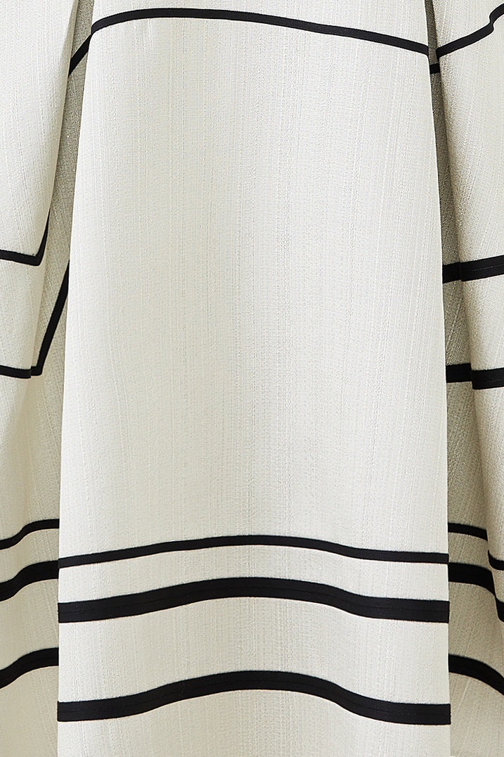 Black and white striped A-line swing skirt with sculpted silhouette, minimalist design with bold graphic contrast.