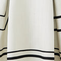 Black and white striped A-line swing skirt with sculpted silhouette, minimalist design with bold graphic contrast.