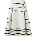 Black and white striped A-line swing skirt with sculpted silhouette, minimalist design with bold graphic contrast.