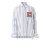 Women's blue and white striped cotton shirt with intricate Miao embroidery, contemporary design inspired by traditional craftsmanship.