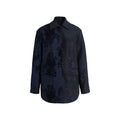 Hui Milano long-sleeve patchwork jacket with dark blue floral motifs on one side and dark grey dragon embroidery on the other, lapel collar, front button closure, hand-bound beads, and seawater embroidery, elegant and culturally inspired design, front view on white background.