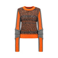 Hui Milano long-sleeve sweater with round neckline, mixed weave in brown, black, and grey melange yarns, accented with orange and grey details on sleeves, collar, and hem, soft warm material with sporty elements, front view on white background.