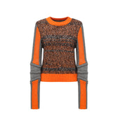 Hui Milano long-sleeve sweater with round neckline, mixed weave in brown, black, and grey melange yarns, accented with orange and grey details on sleeves, collar, and hem, soft warm material with sporty elements, front view on white background.