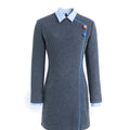 Hui Milano mid-length gray qipao with light blue shirt-style collar, right-side blue lines and two colorful buttons, tailored fit with lace details, blending traditional design with contemporary elegance, front view on white background.