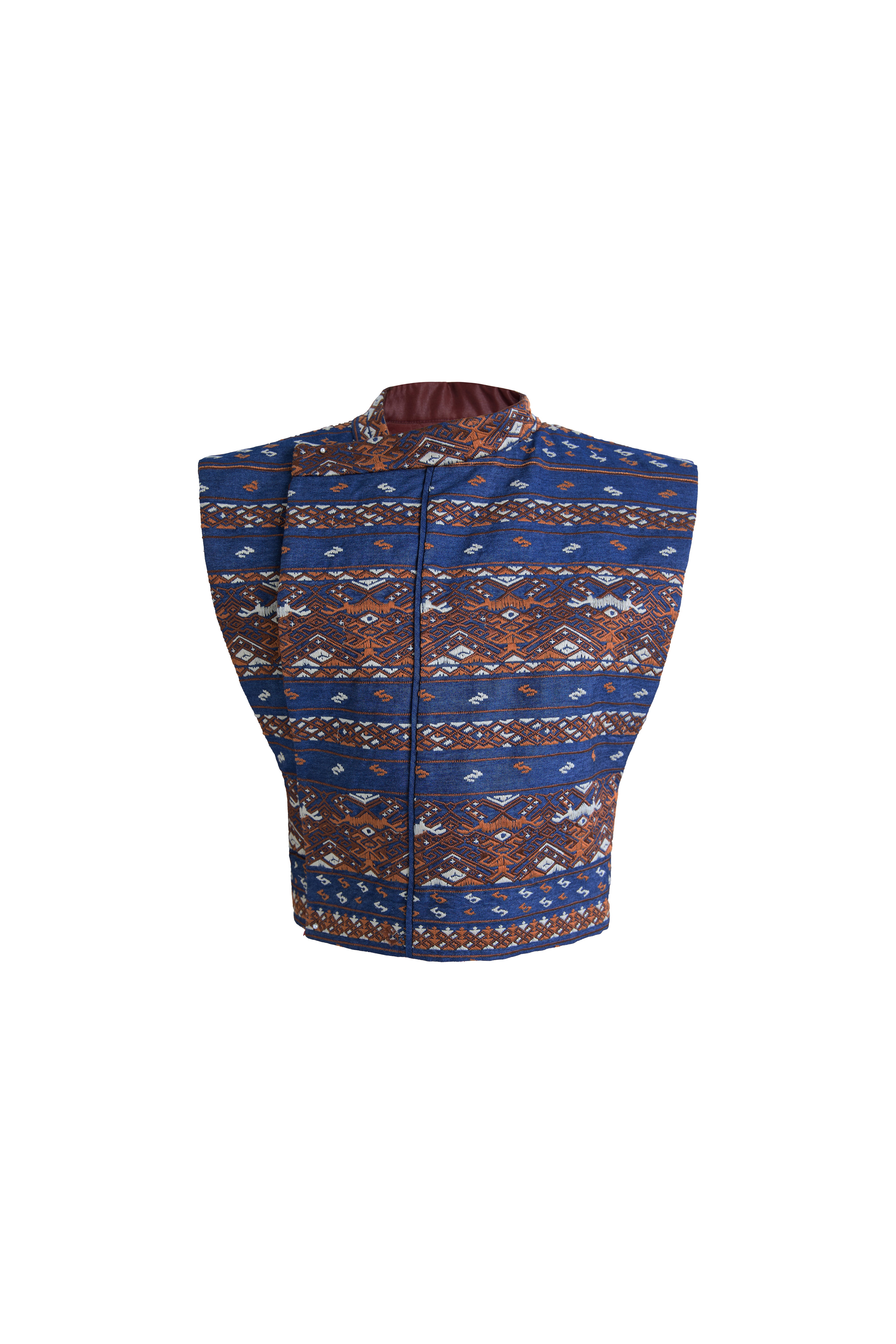 Hui Milano sleeveless blue denim waistcoat fully decorated with traditional Miao embroidery, featuring high collar, reversible double-sided design, and hand-dyed jacquard fabric, blending cultural heritage with modern versatility, front view on white background.