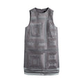 Hui Milano sleeveless grey A-line dress fully adorned with traditional Miao embroidery, intricate patterns with sheer hem inserts, blending cultural craftsmanship with contemporary fashion, front view on white background.