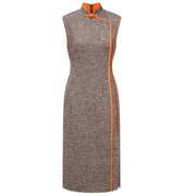 Hui Milano sleeveless grey qipao-style dress with high collar, traditional buttons, and orange accents on collar and sides, slim and elegant silhouette blending classic qipao elements with modern design, front view on white background.