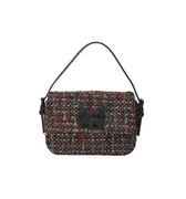 Hui Milano tweed bag in black and brown with black leather handles, combining textured fabric and sleek leather for a timeless and versatile accessory, front view on white background.