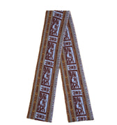 Hui Milano long wool scarf in brown, grey, and blue-white tones with distinctive geometric and stylized motifs, versatile accessory for elegant or casual outfits, front view on white background.