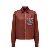 Hui Milano Xiangyun men’s shirt, terracotta brown silk-cotton blend with masculine collar and embroidered chest pocket featuring chain stitching, front view on white background.