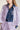 Purple sequin coat with wave-inspired ruffle details and traditional Chinese stand collar, elegant outerwear blending cultural heritage with modern sophistication.