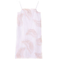 Purple slip dress with sheer fabric and intricate lace-inspired pattern, flowing silhouette influenced by Chinese motifs and modern craftsmanship.