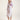 Purple slip dress with sheer fabric and intricate lace-inspired pattern, flowing silhouette influenced by Chinese motifs and modern craftsmanship.