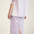 Loose-fit purple striped shirt with wave-pattern embroidery trim, inspired by Chinese artistry and traditional craftsmanship.