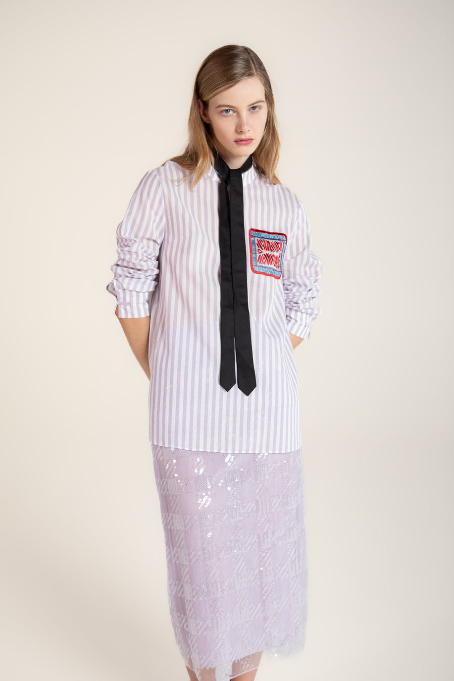 Loose-fit purple striped shirt with wave-pattern embroidery trim, inspired by Chinese artistry and traditional craftsmanship.