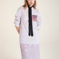 Loose-fit purple striped shirt with wave-pattern embroidery trim, inspired by Chinese artistry and traditional craftsmanship.